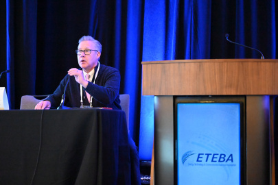 The PPPO and Oak Ridge field manager Erik Olds sitting at a panel table on a stage