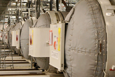A room full of large grey autoclaves at the Portsmouth Paducah Project Office