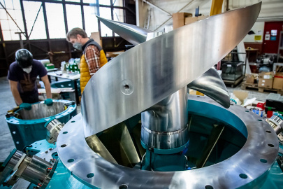 A uniquely thick and forward-swept turbine runner blade awaits the addition of the runner housing at Natel Energy's headquarters in Alameda, California.
