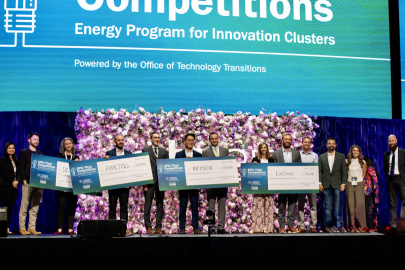 EPIC winners holding checks