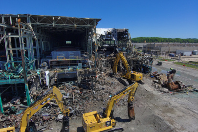 Aerial view of demolition taking place on the corner of a large building