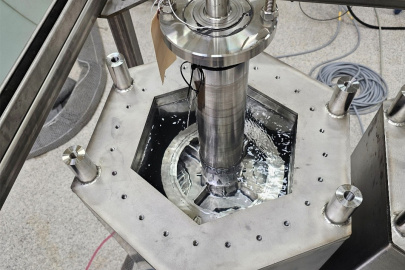 A metal ultrasonic cleaning machine inside a laboratory
