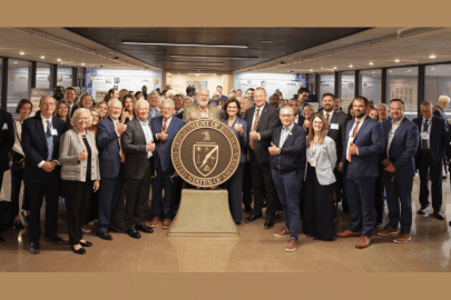 Rotating set of imaged of meetings taking place and a large group photo