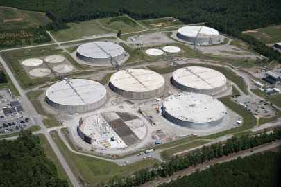 Aerial view of six large circular disposal unit buildings at the Savannah River Site