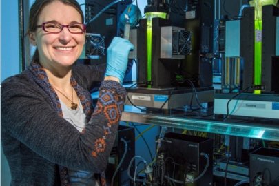 Photo of Amanda Barry inside of an algae lab.