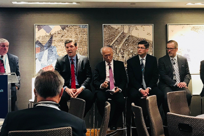 Men talk during a panel about energy and nuclear power.