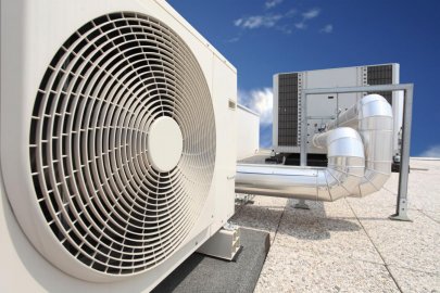 Home air conditioning unit photo on top of a roof