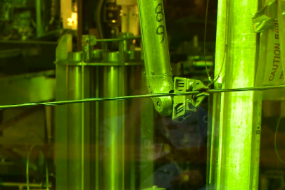 A photo of a mechanical claw inside a hot cell
