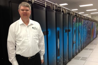 Project director Buddy Bland stands by Titan, the hybrid-architecture Cray XK7 system at Oak Ridge Leadership Computing Facility. 