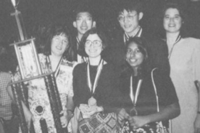 Left to right, in the back: Si Hwang Chin, Peter Chan, Renee Landrum. Front row: coach Penny Sconzo, Susan Born, and Shireen Haque with their 1994 National Science Bowl® trophy.