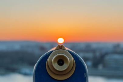 a view froma building top looking at a telescope.