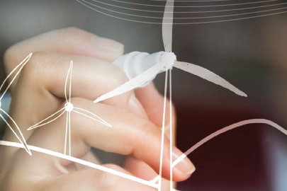 Photo of someone drawing a wind turbine.