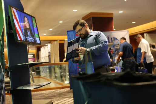 A person interacts with a booth display