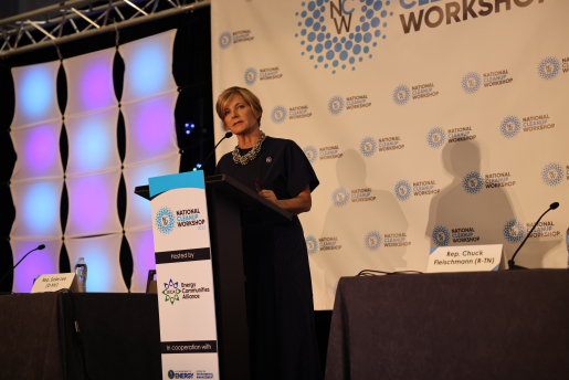 A woman speaks at a podium