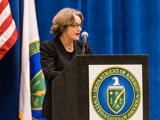 A person standing at a podium speaking.