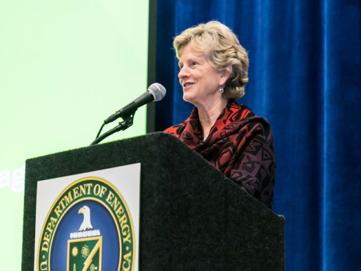 A person standing at a podium speaking.
