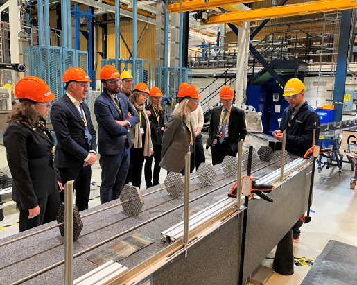 The NNSA Administrator and others look at the metal "skeleton" of the VVER-440 assembly.