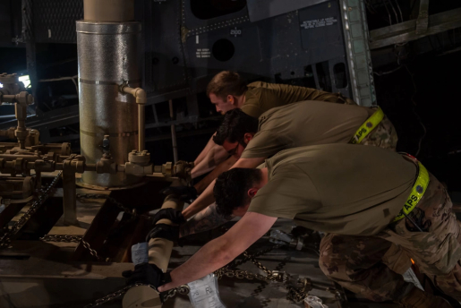 U.S. Airmen assigned to the 437th Aerial Port Squadron, push equipment onto a C-5 Super Galaxy at Joint Base Charleston, South Carolina Jan. 31, 2023. This cargo is part of a $53 million humanitarian package announced by the U.S. Secretary of State, endeavoring to offset continued Russian attacks on Ukraine’s energy infrastructure.