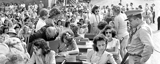 Black and white photo of a large crowd of people.