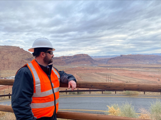 A person looking out over desert landscape.