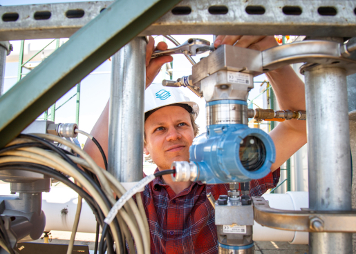 Person adjusting sensors on equipment