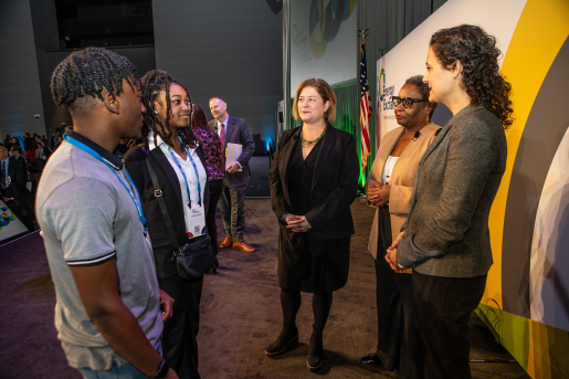People having a conversation at a conference.