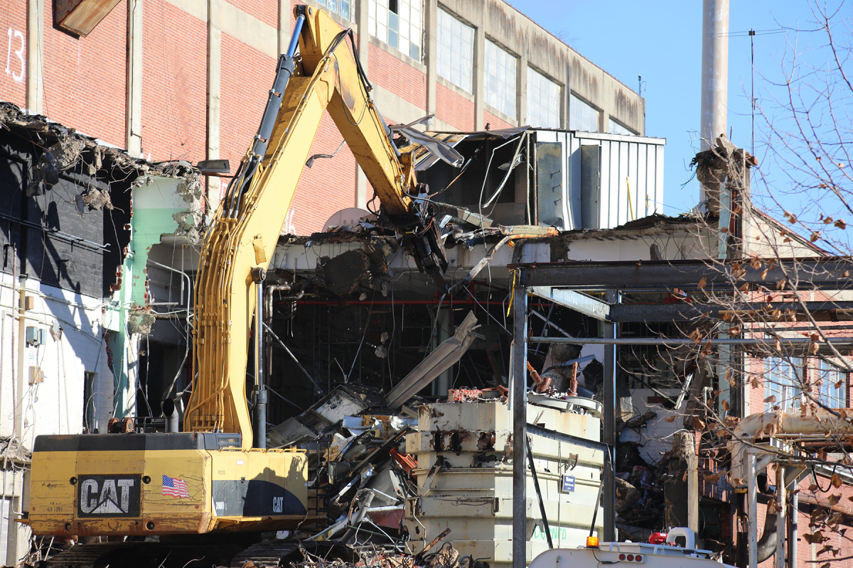 A crane demolishing a building