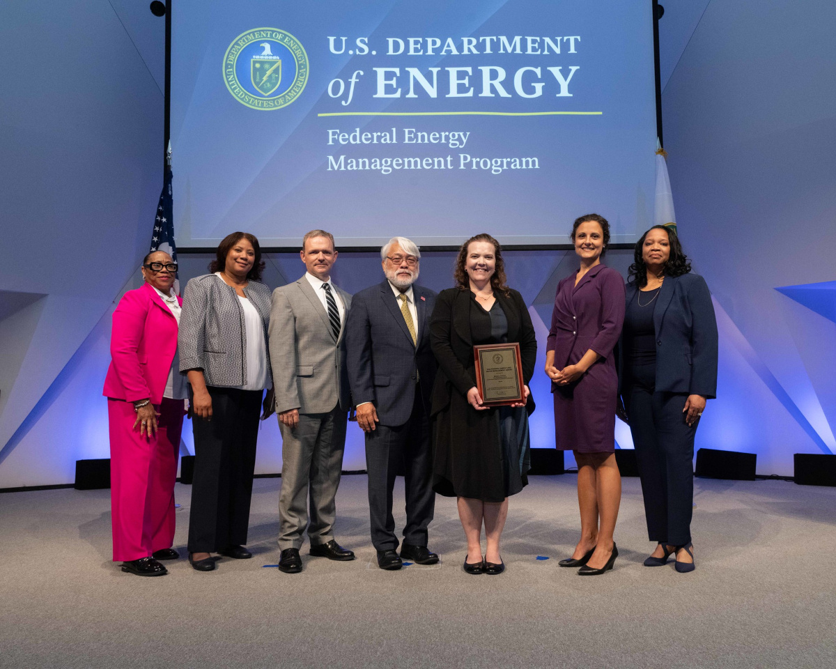 A group of people posing for a photo at the 2024 Federal Energy and Water Management Awards ceremony.
