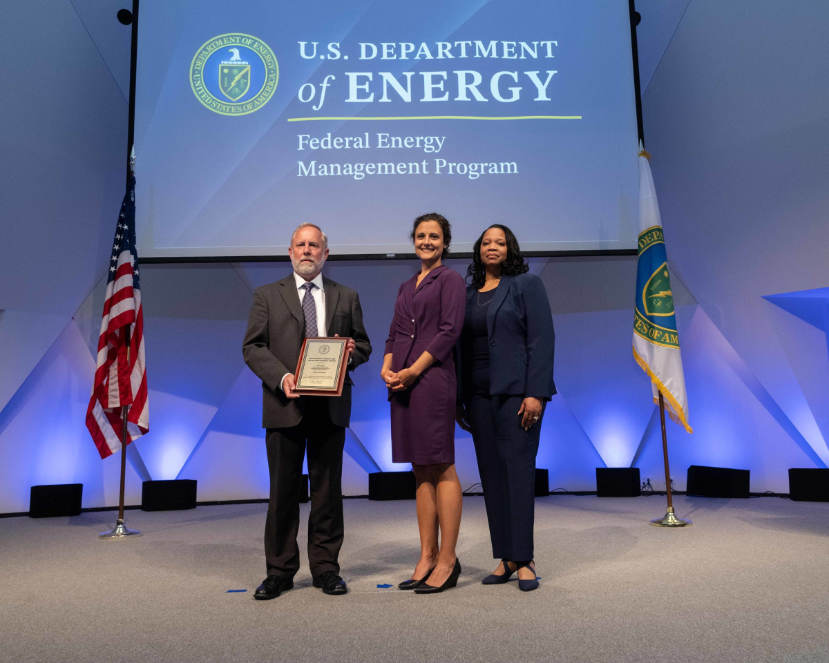 A group of people posing for a photo at the 2024 Federal Energy and Water Management Awards ceremony.