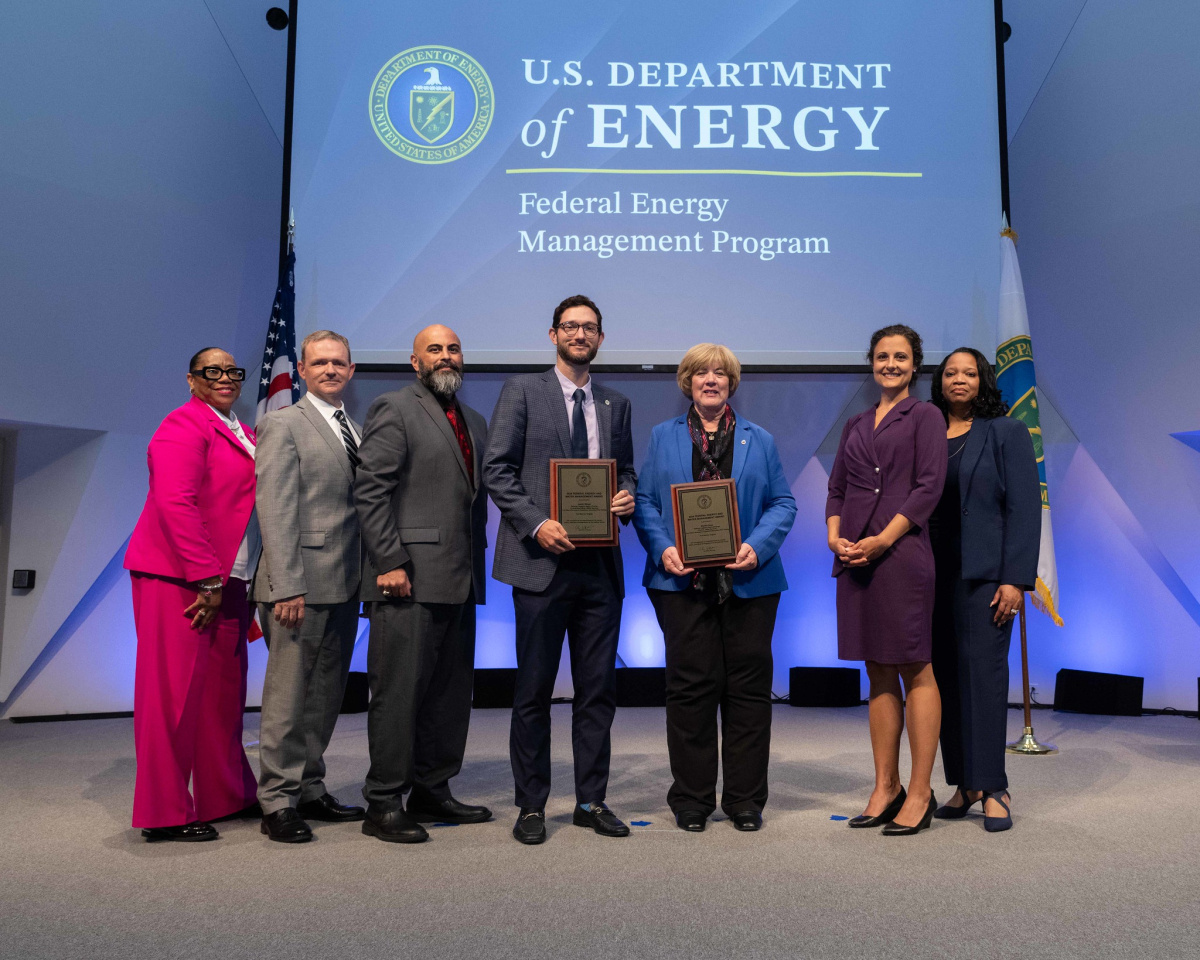 A group of people posing for a photo at the 2024 Federal Energy and Water Management Awards ceremony.