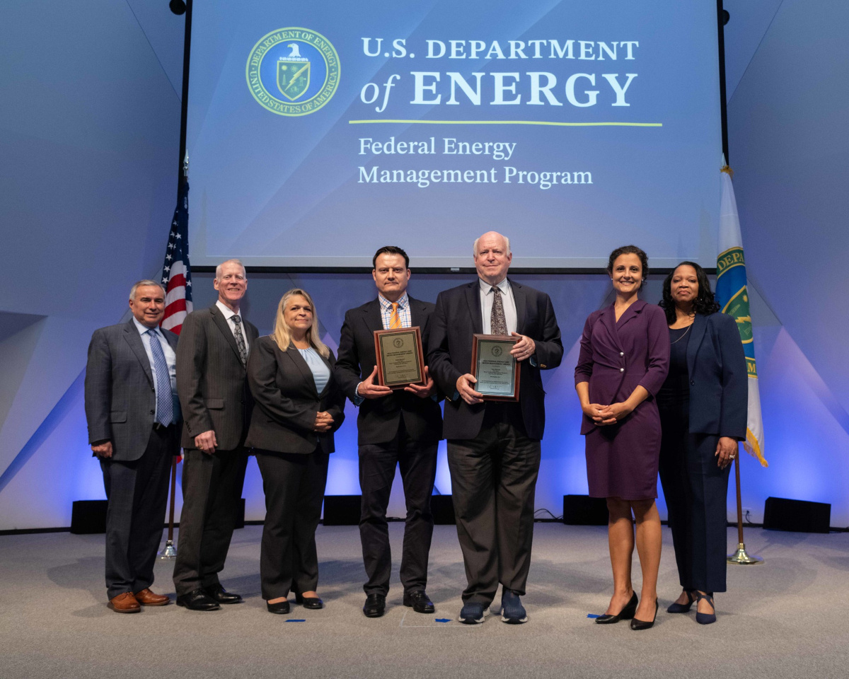 A group of people posing for a photo at the 2024 Federal Energy and Water Management Awards ceremony.