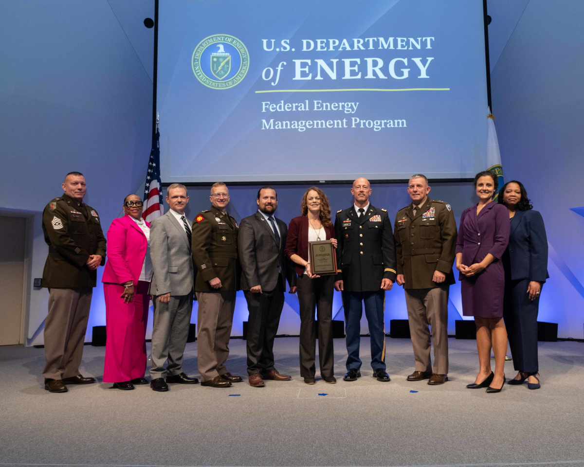 A group of people posing for a photo at the 2024 Federal Energy and Water Management Awards ceremony.