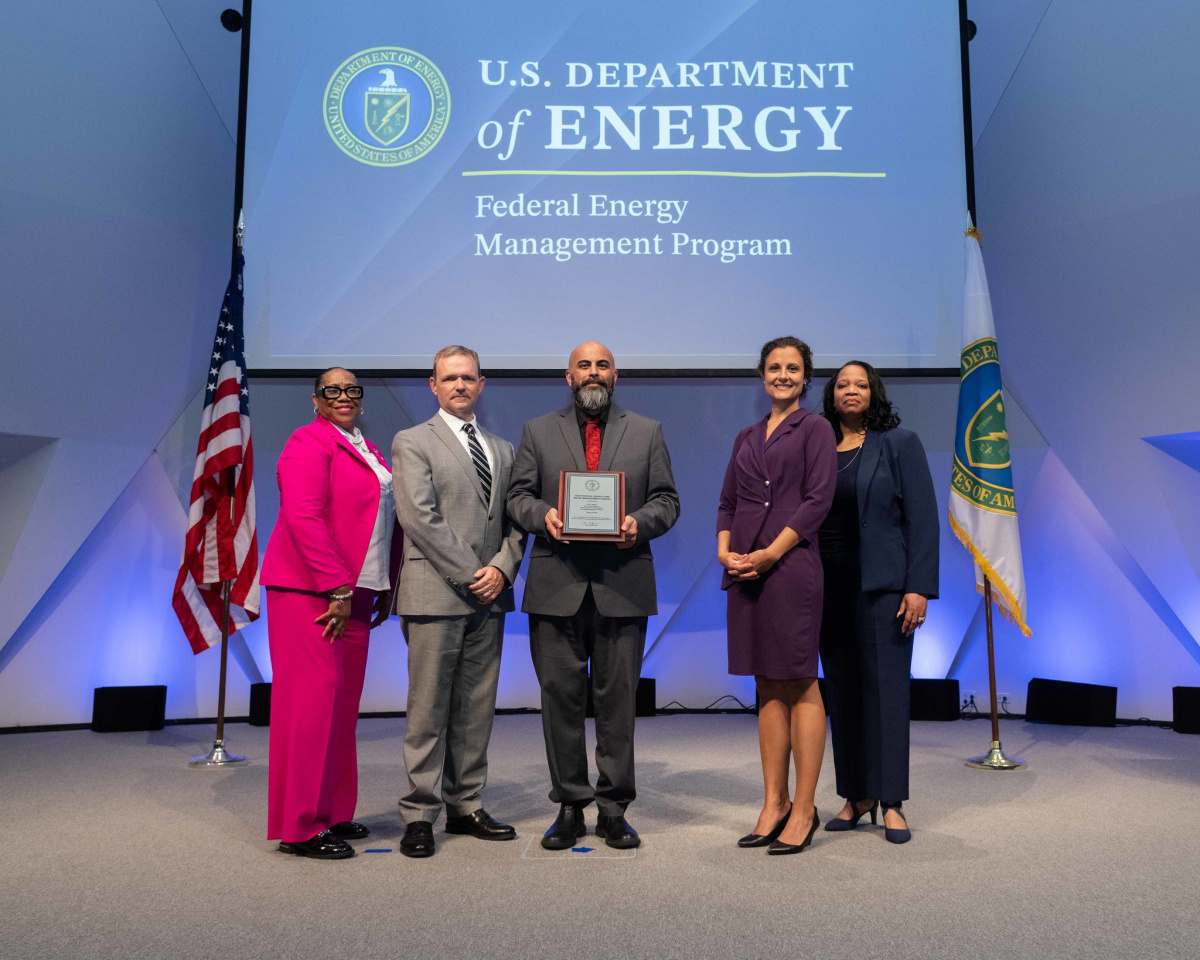 A group of people posing for a photo at the 2024 Federal Energy and Water Management Awards ceremony.