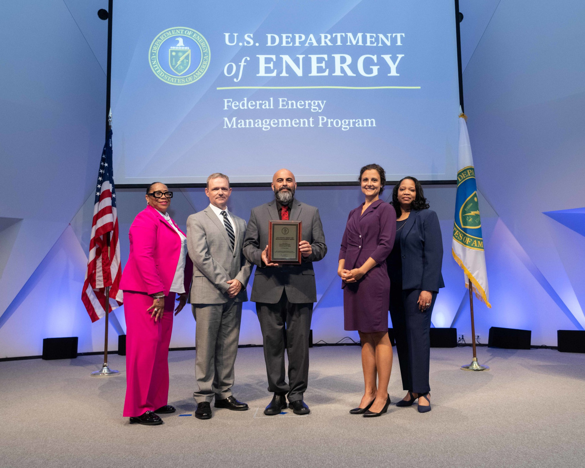A group of people posing for a photo at the 2024 Federal Energy and Water Management Awards ceremony.