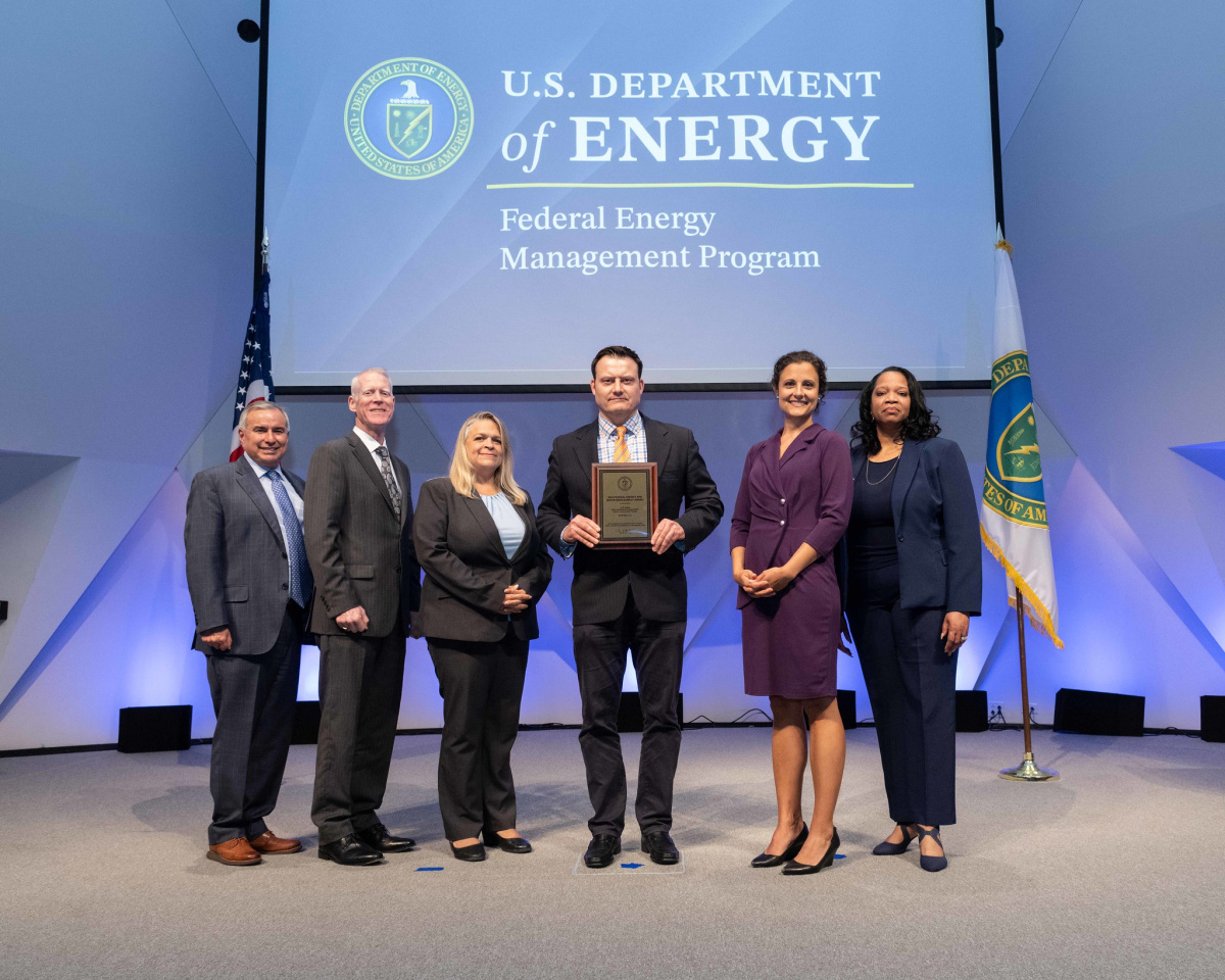 A group of people posing for a photo at the 2024 Federal Energy and Water Management Awards ceremony.