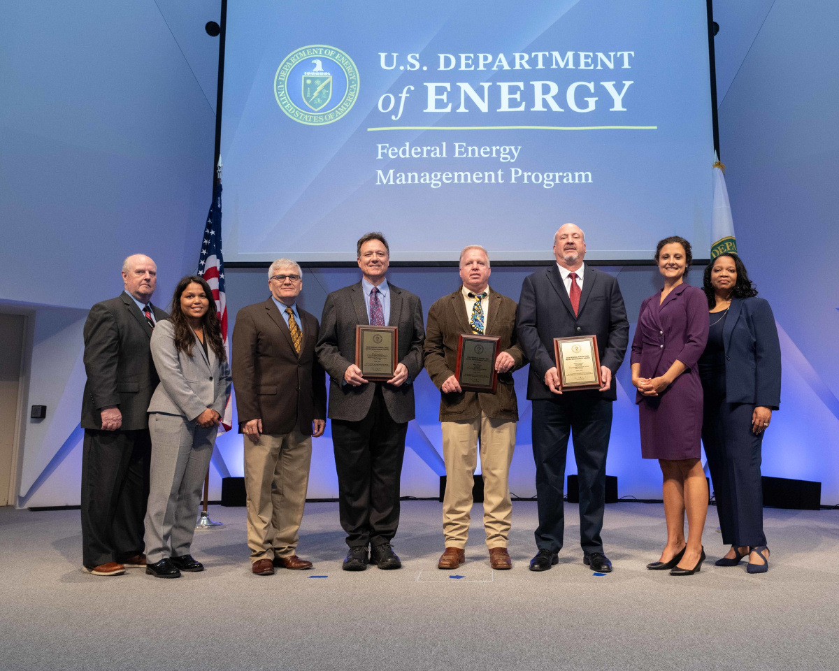 A group of people posing for a photo at the 2024 Federal Energy and Water Management Awards ceremony.