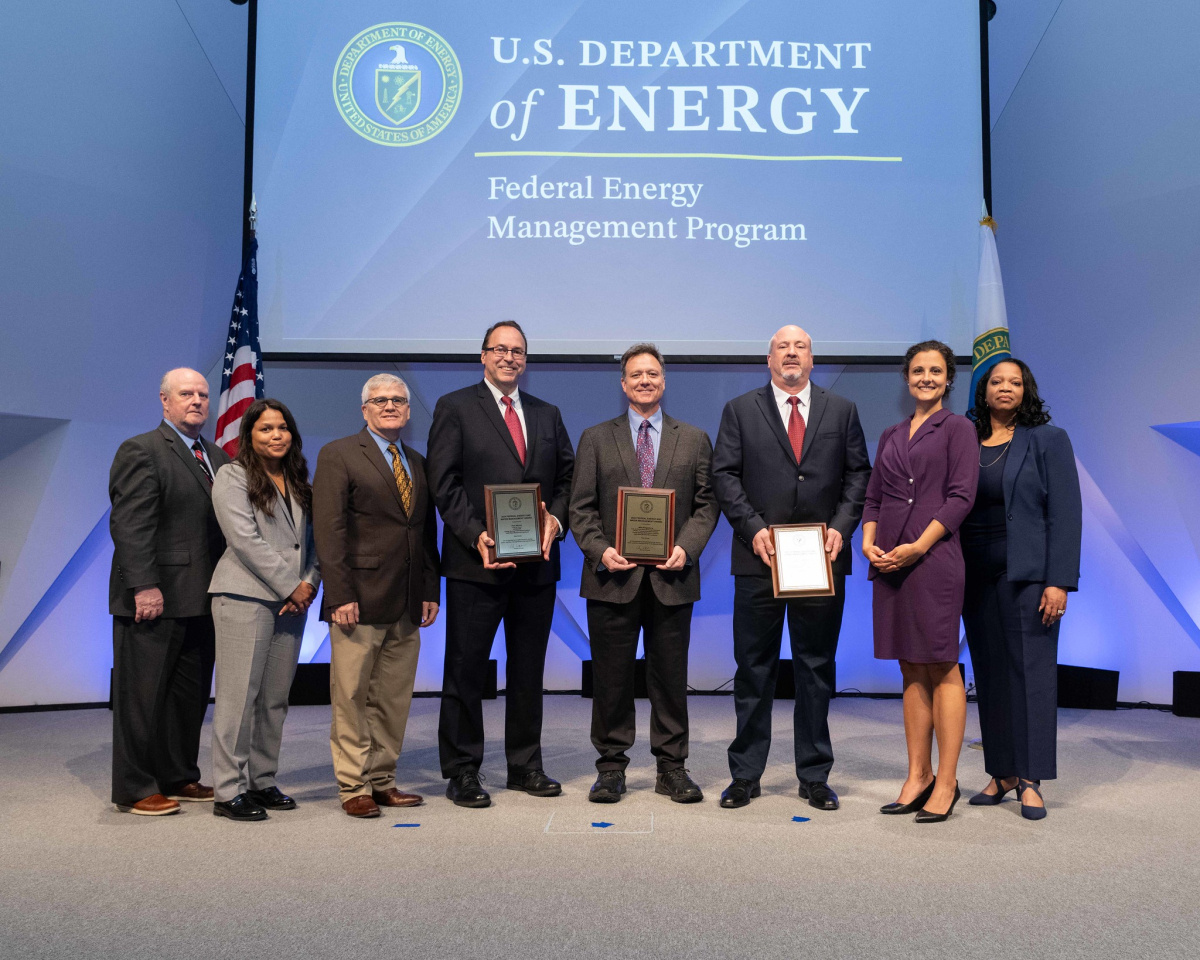 A group of people posing for a photo at the 2024 Federal Energy and Water Management Awards ceremony.