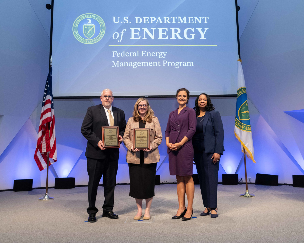 A group of people posing for a photo at the 2024 Federal Energy and Water Management Awards ceremony.