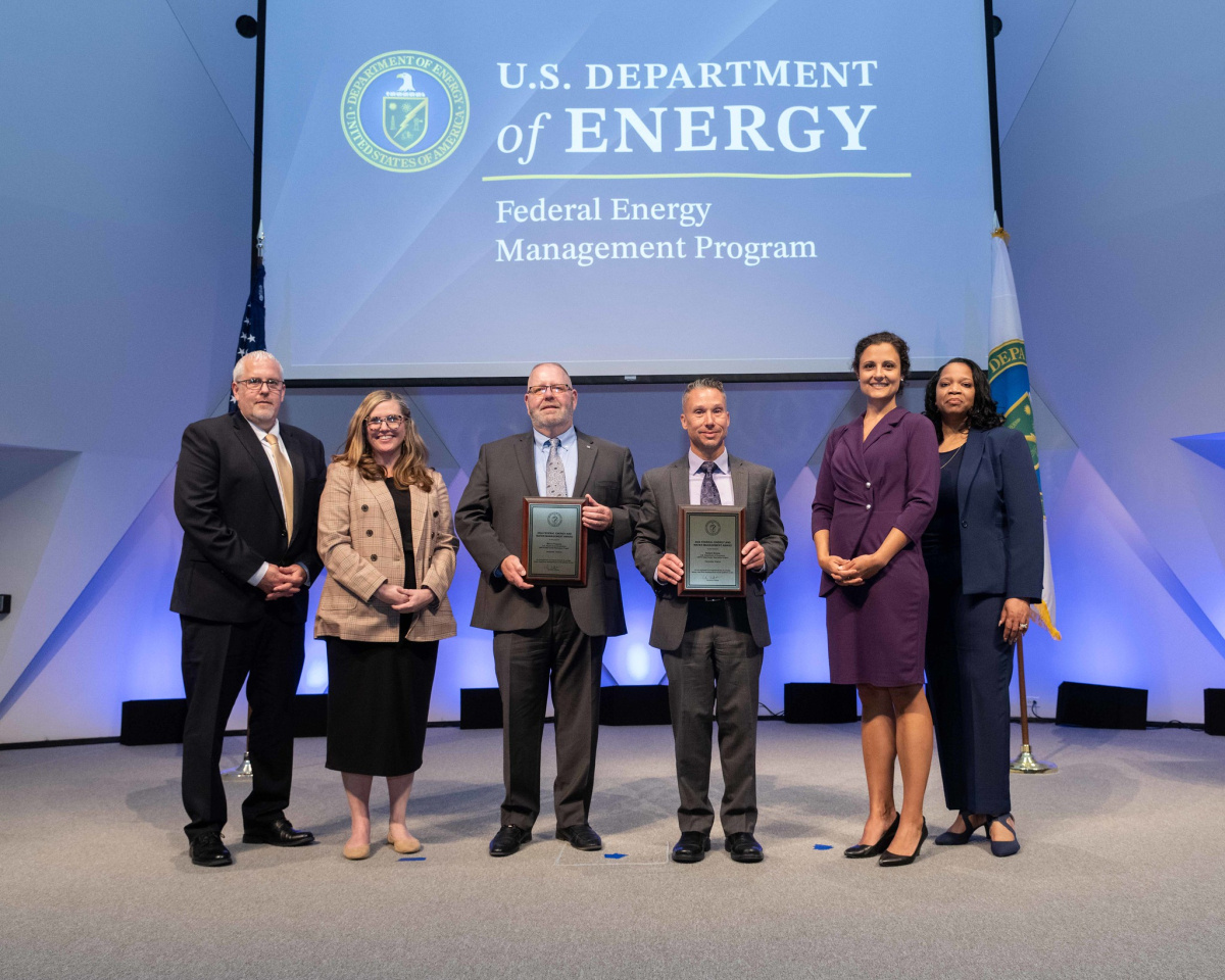 A group of people posing for a photo at the 2024 Federal Energy and Water Management Awards ceremony.