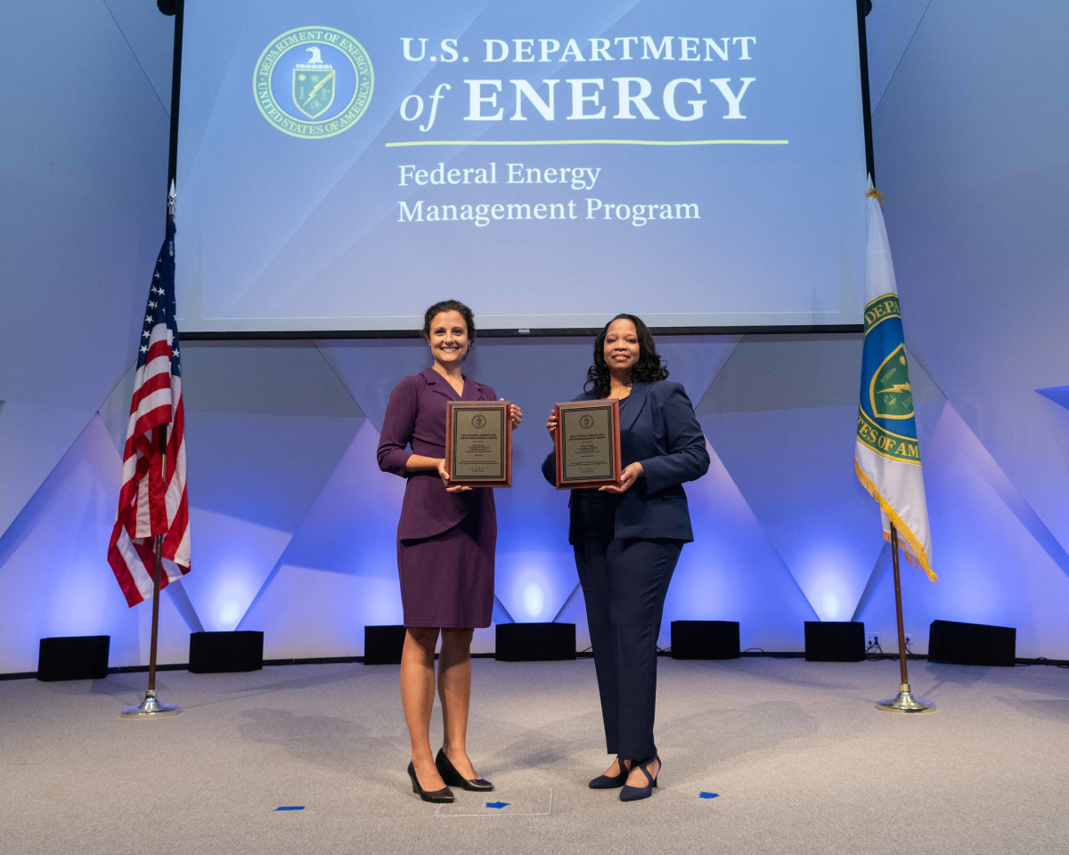 A group of people posing for a photo at the 2024 Federal Energy and Water Management Awards ceremony.