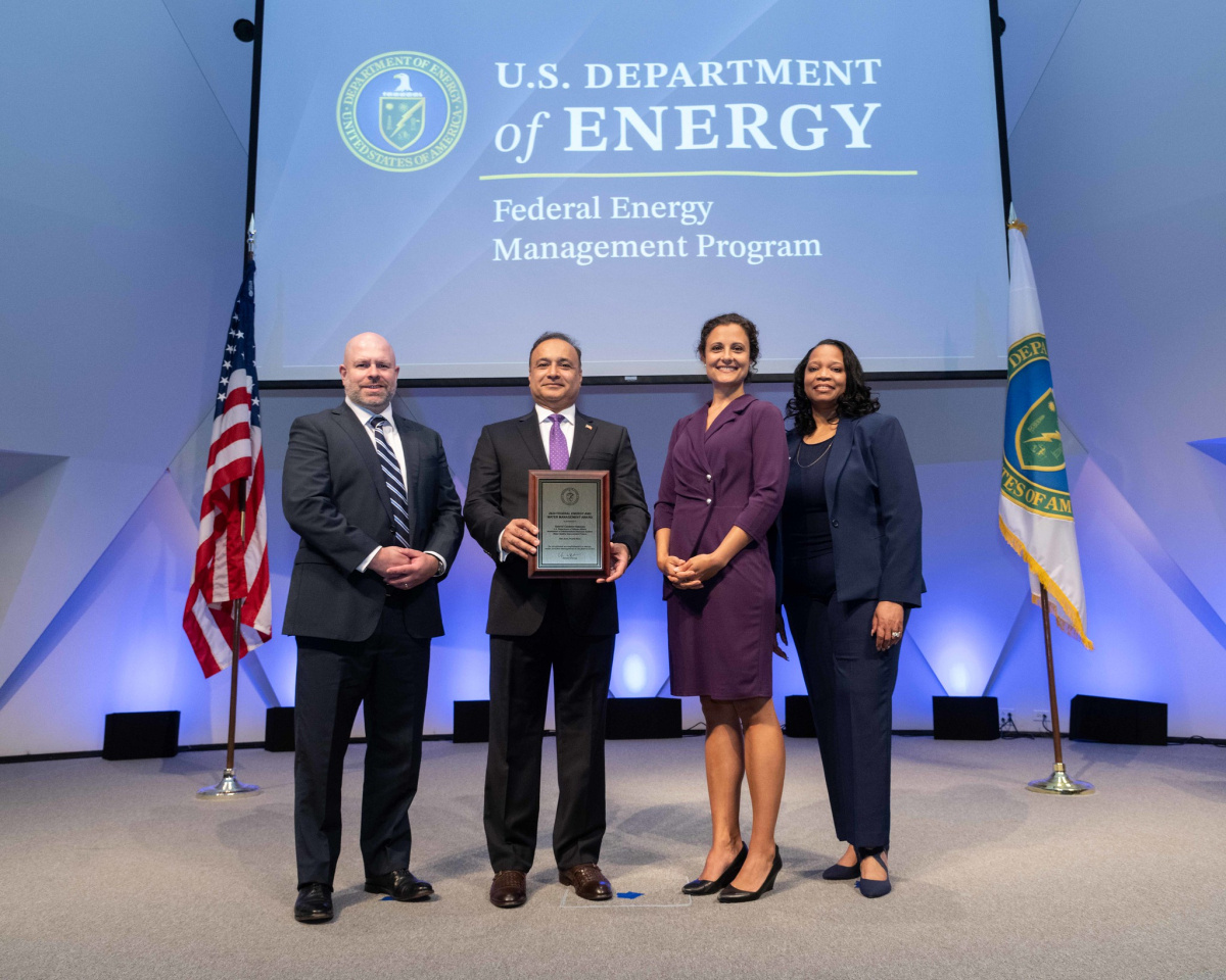 A group of people posing for a photo at the 2024 Federal Energy and Water Management Awards ceremony.