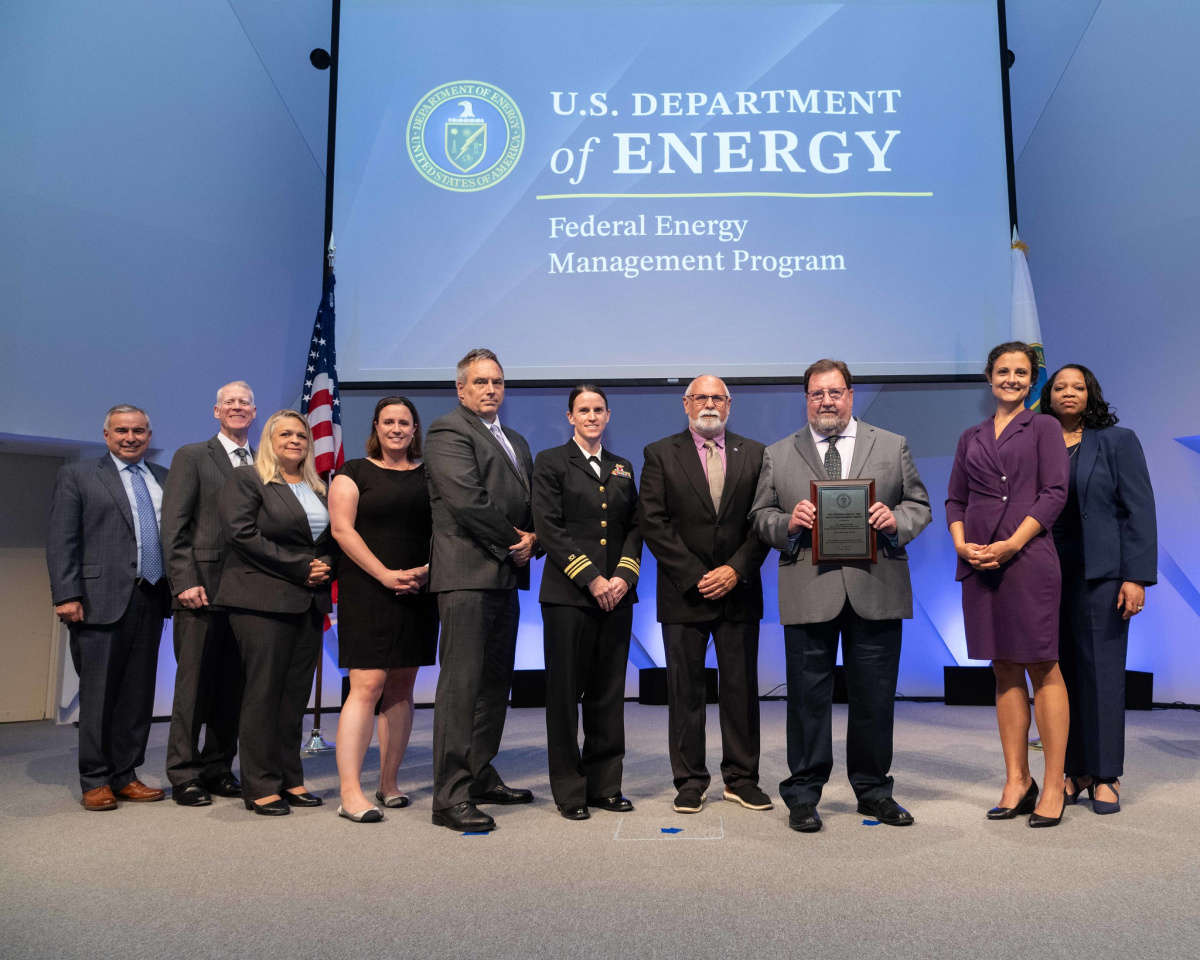A group of people posing for a photo at the 2024 Federal Energy and Water Management Awards ceremony.