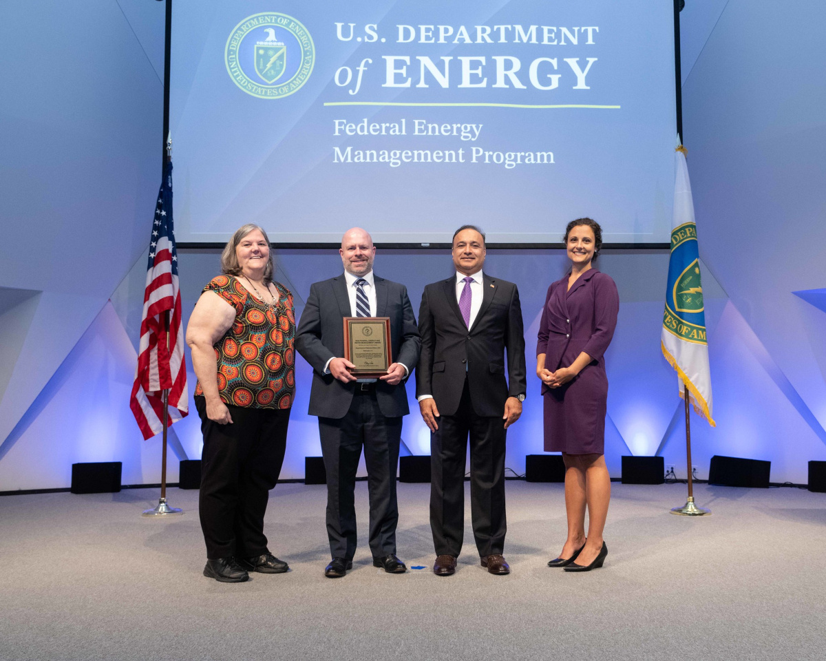 A group of people posing for a photo at the 2024 Federal Energy and Water Management Awards ceremony.