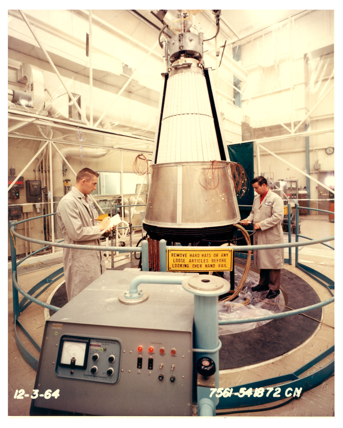 Men work on nuclear power reactor at ETEC