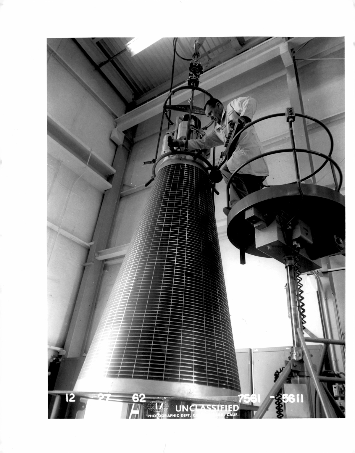 Man works on SNAP power reactor