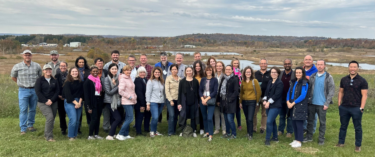 A large group of people posing for a photo outside