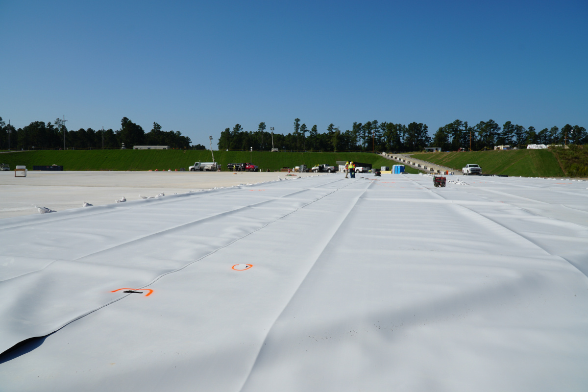 A large plastic liner laid out at SRS