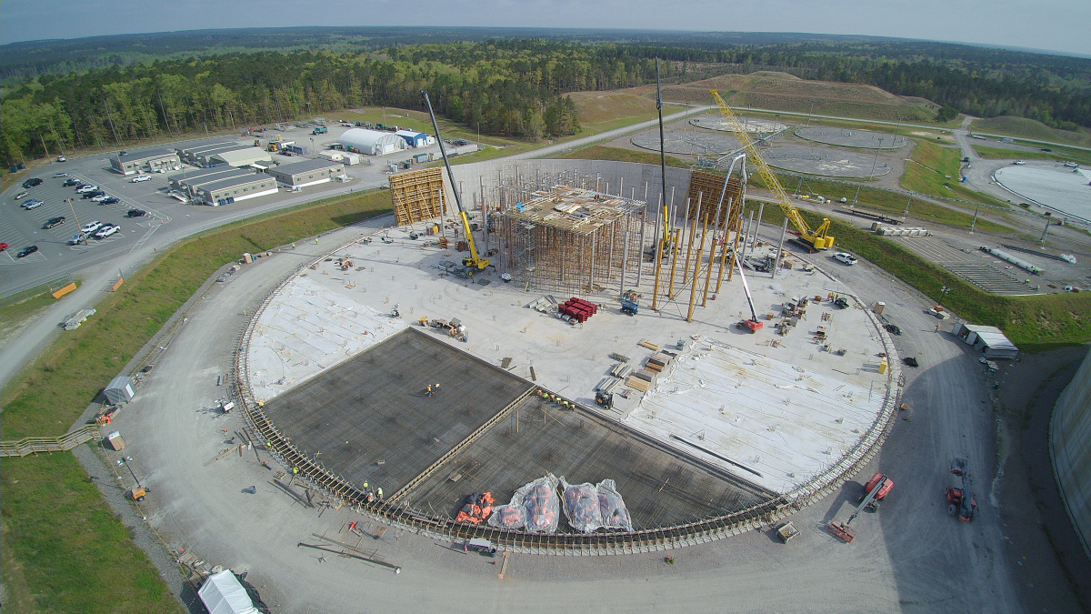 Aerial view of a large circular disposal cell being constructed