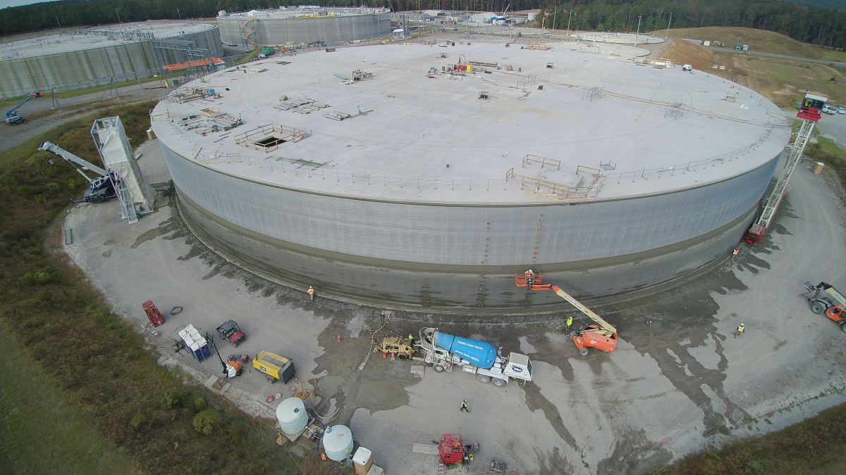 Aerial view of wrapping being applied to a large circular building