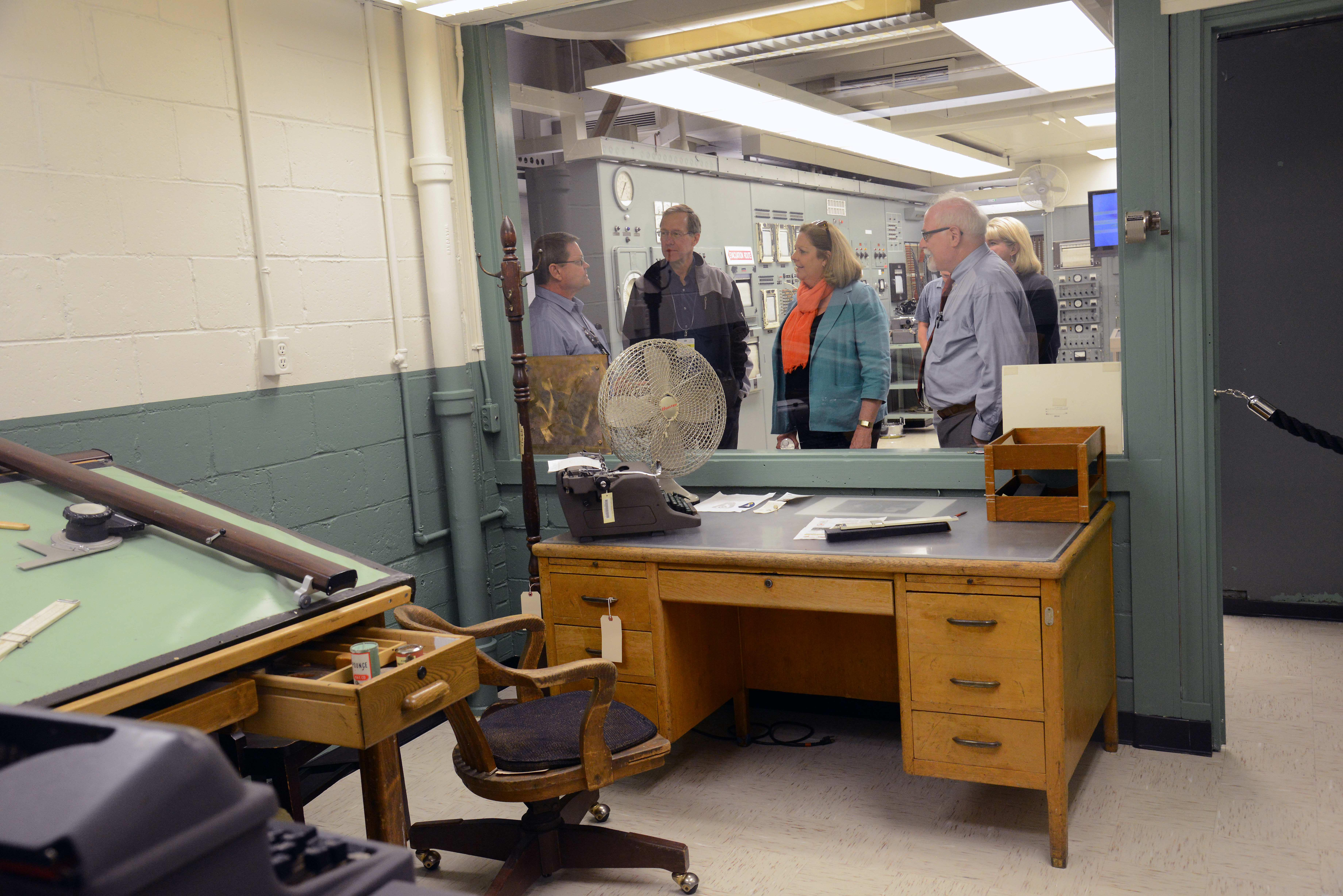 Vic Knox, Peggy O’Dell, and David Klaus briefed in the B Reactor control room Vic Knox, Peggy O’Dell, and David Klaus briefed in the B Reactor control room